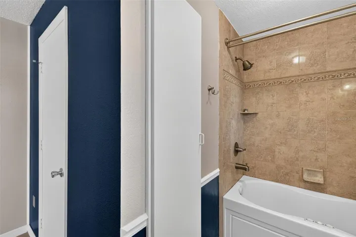 Primary Bathroom Suite Jetted Tub and Towel Closet