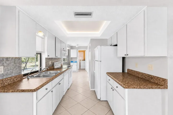 Galley Kitchen with Updated Decorative Lit Ceiling