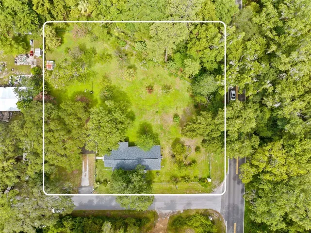 Almost a full acre with privacy fence separating the neighboring property &amp; chainlink surrounding the rest.