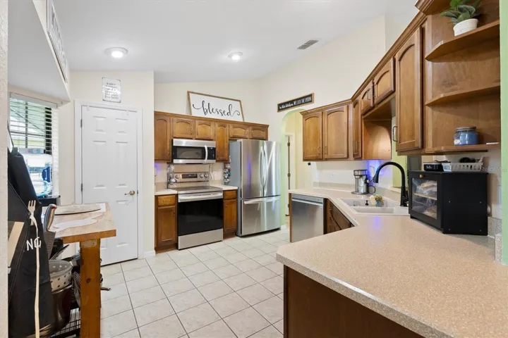 Kitchen with closet pantry.