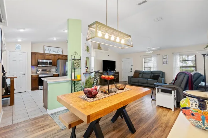Dining room with living room to right, kitchen to left.