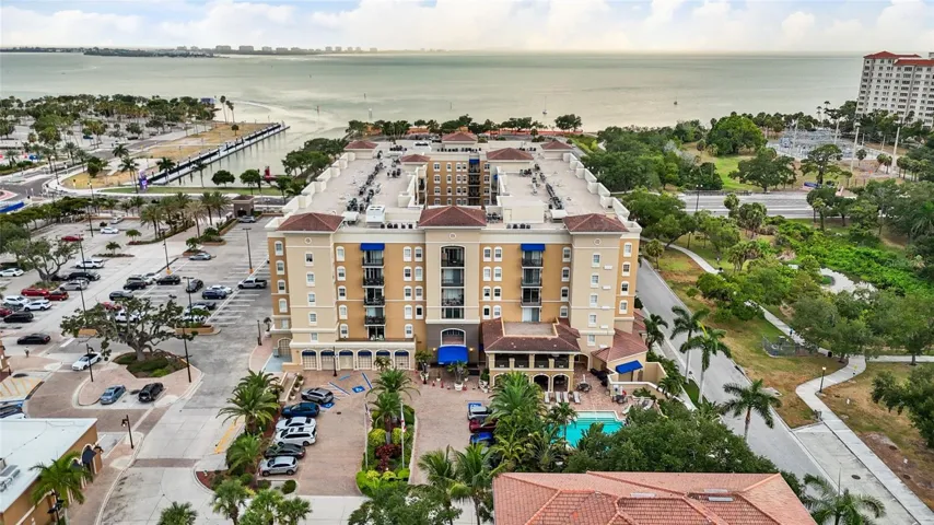 The main entrance is on the East side of the building and includes several guest parking spaces.