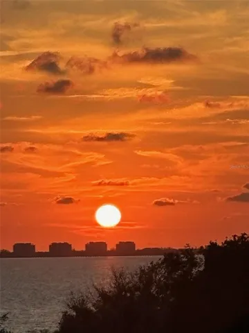 Imagine witnessing this orange sunset over Sarasota Bay from your balcony!