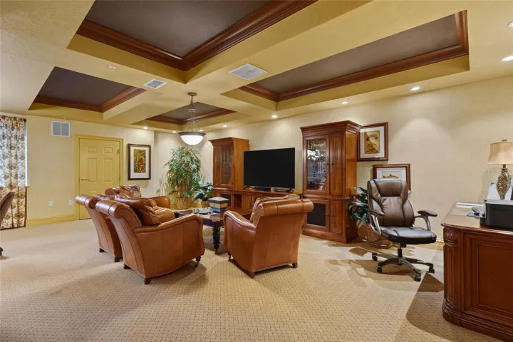 One community room includes a TV, business center with printer, gaming table, and pool table.