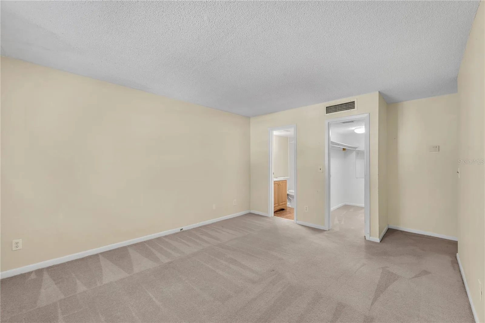 The other end of Primary bedroom with bath and walk in closet