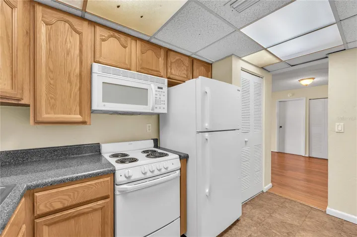 Microwave, range and refrigerator are included. Bring your stackable washer/dryer, there are utility hook ups in the closet on the right.