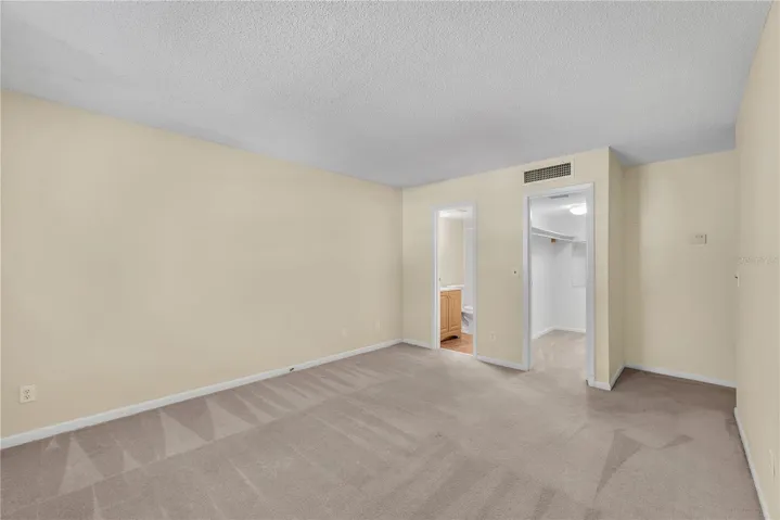 The other end of Primary bedroom with bath and walk in closet