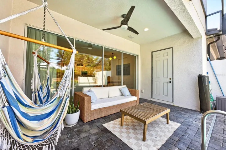 A wall of sliding glass doors open to the covered lanai.