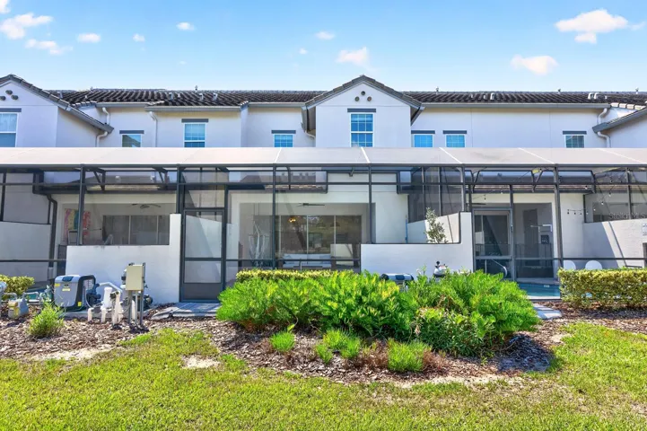 The screened lanai and pool has access to the green space in the back.