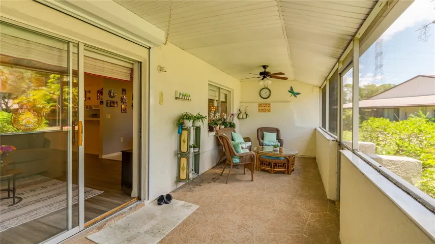 REAR PATIO SCREENED WITH HURRICANE SHUTTER