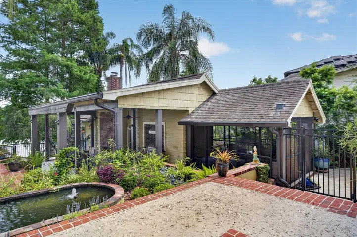 Detached guest house/in-law suite with carport currently used as screened porch