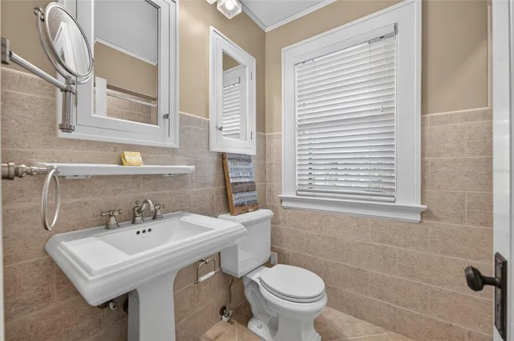 Bath with tub/shower pedestal sink, built-in storage for bedroom two