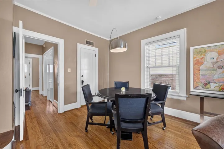Game table area in family room; hallway leads to half bath