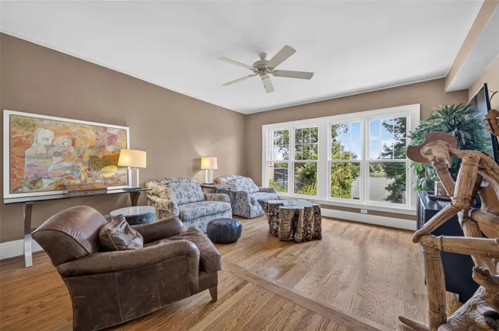 Spacious family room/game room with lake views; on level two adjacent to kitchen and dining room