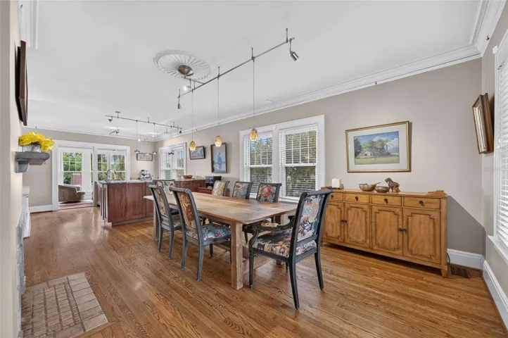 Formal dining room with gas fireplace, and European style kitchen located on the main entry level of the home.