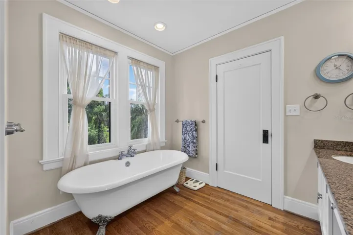 Primary bath soaking tub overlooks lake