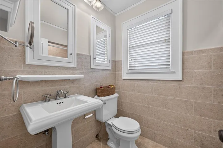 Bathroom with tub/shower and built-in storage for bedroom three