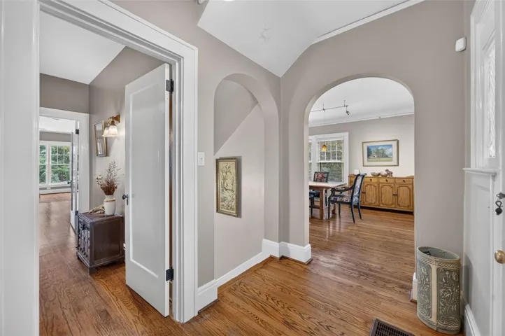 Classic details, stately foyer, oak floors, wood mouldings in this quintessential home