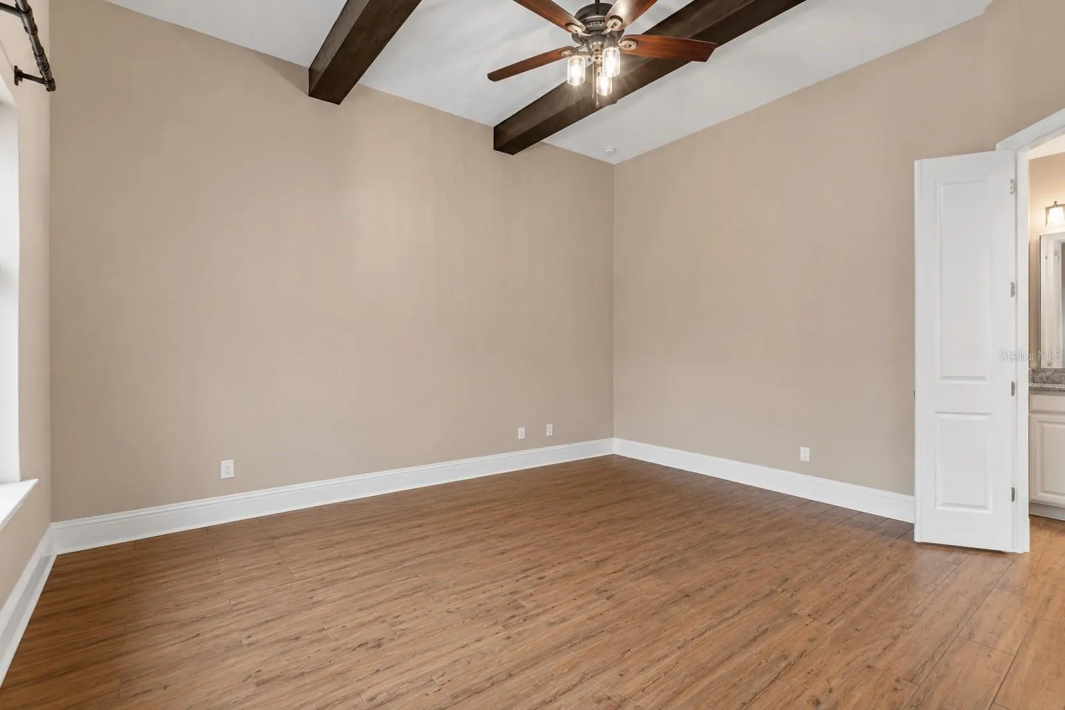 AI-edited to remove furniture to show the space