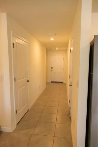 Hallway to additional bedrooms/ back towards front door.