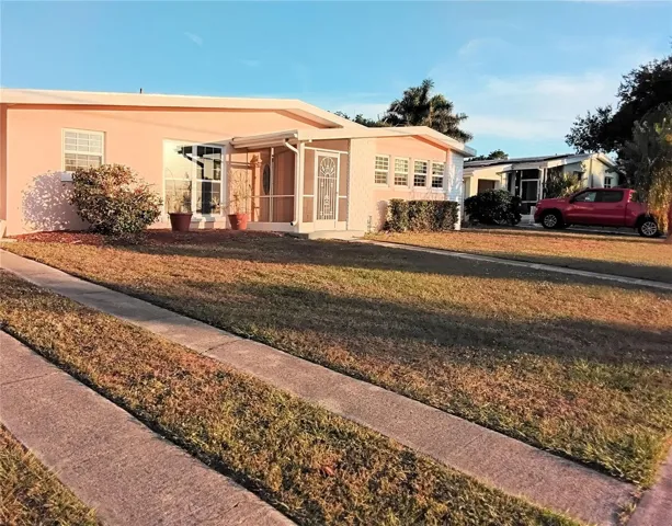 Front view of home to the right of carport