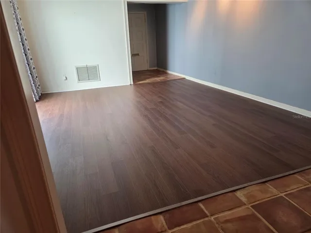 Brand new luxury vinyl flooring installed in living room on 5/1/26