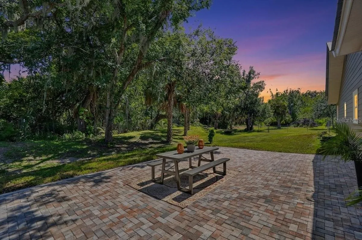 Side back yard large paver area- room for pool