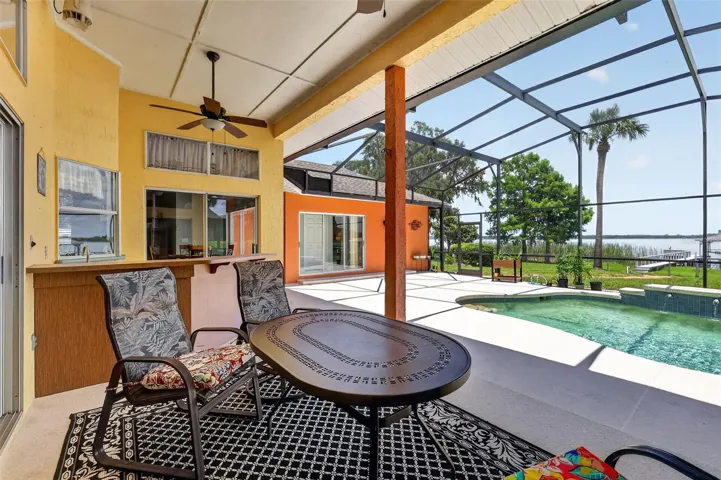 Lots of space to entertain by the pool while overlooking Lake Dora
