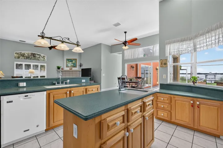 Kitchen overlooks dinette and family room