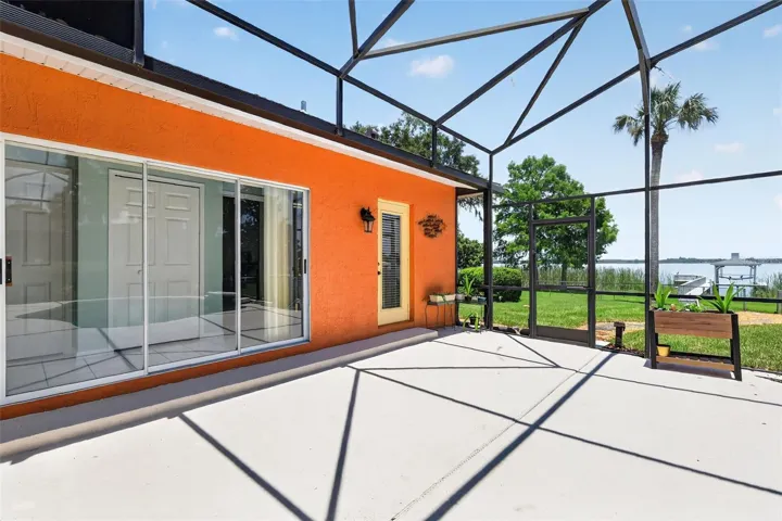 Pool deck; sliders to secondary bedrooms; door leads to pool bath.