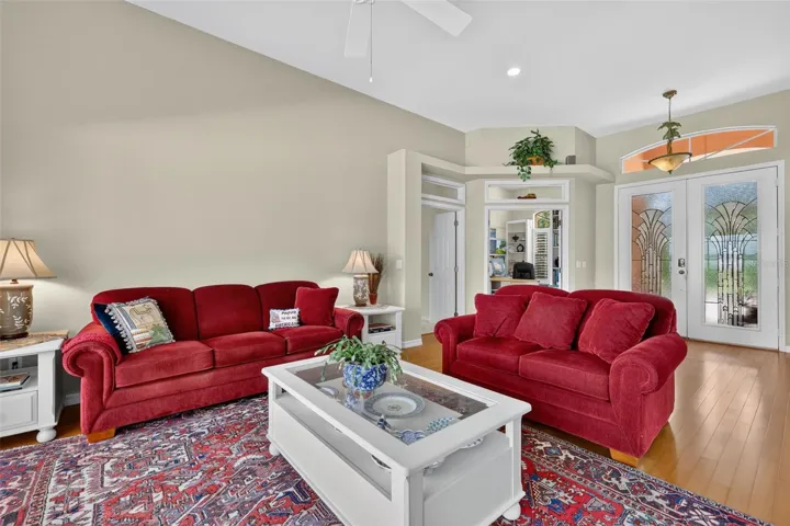 Living room, with entrances to primary bedroom and home office