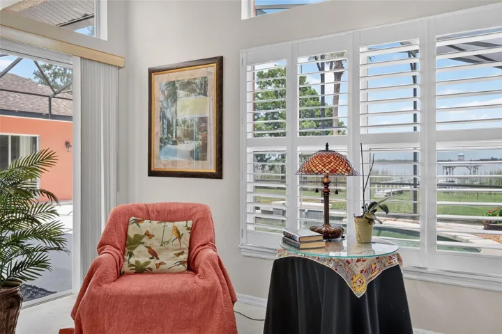 Primary bedroom with sliding doors to pool, Plantation shutters, and gorgeous views