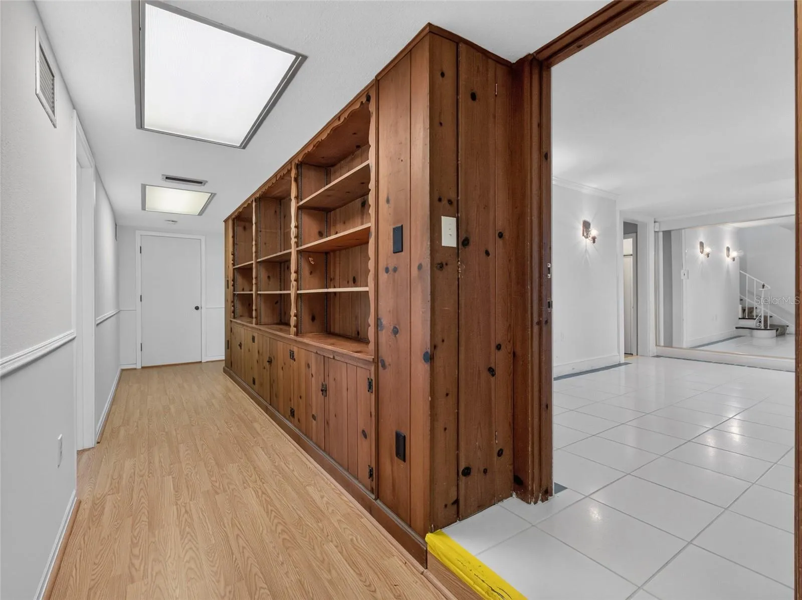 Hall with built in wood cabinets