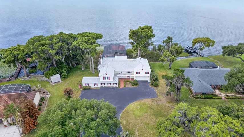 Lake Harris Lakefront Estate - perfectly sited on more than 1/2 acre you will enjoy chain of lake living nestled on a quiet cul de sac.
