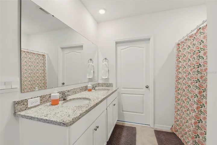 Primary Bathroom with his and hers closets