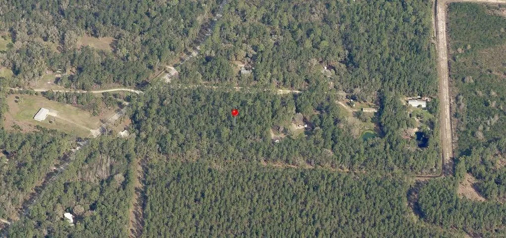 Wider view aerial photo showing hwy 314 to the left and the tree farm to the south or bottom of property.