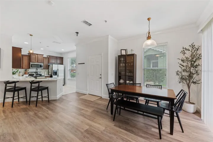 dining area right off the kitchen with additional seating at the bar