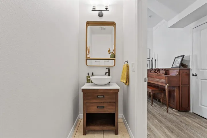 half bathroom downstairs with beautiful upgraded sink and mirror