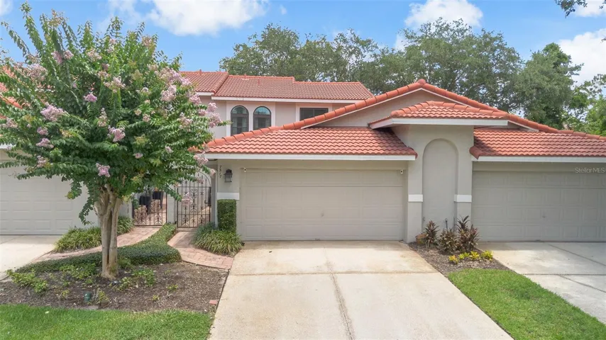 Welcome home to your completely updated and turn key Naples townhome in the gated & highly sought after Sandpointe Townhomes.