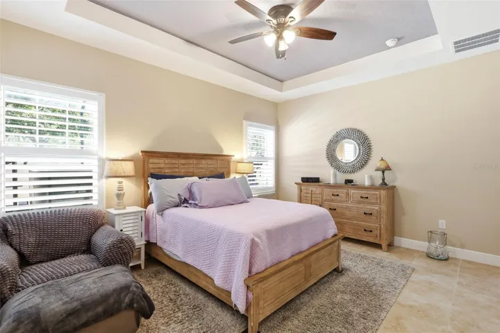 Plantation shutters in primary bedroom