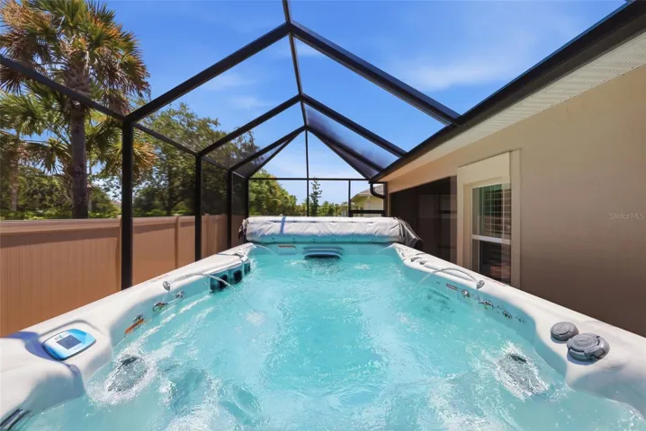 Heated swim spa with fountains, LED lighting