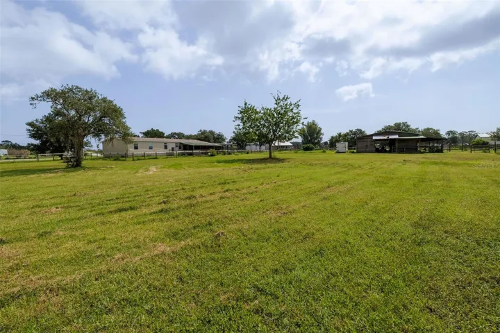 Spacious 4BR home + 8 stall barn on 3.63 acres.