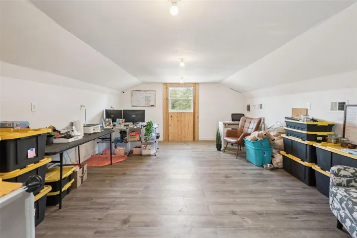Upstairs air conditioned barn office or flex room, ideal for work-from-home, hobbies, storage, or recreation.