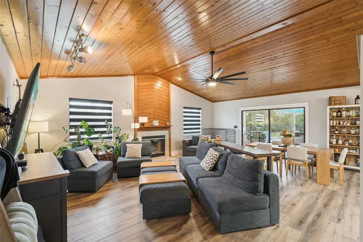 Spacious living room with wood ceilings, natural light, and open flow for everyday living and entertaining.