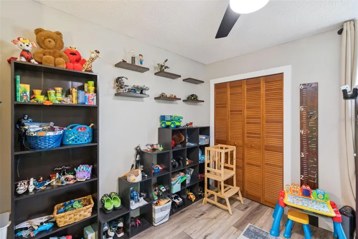 Secondary bedroom, playroom, office, or hobby room with closet and natural light.