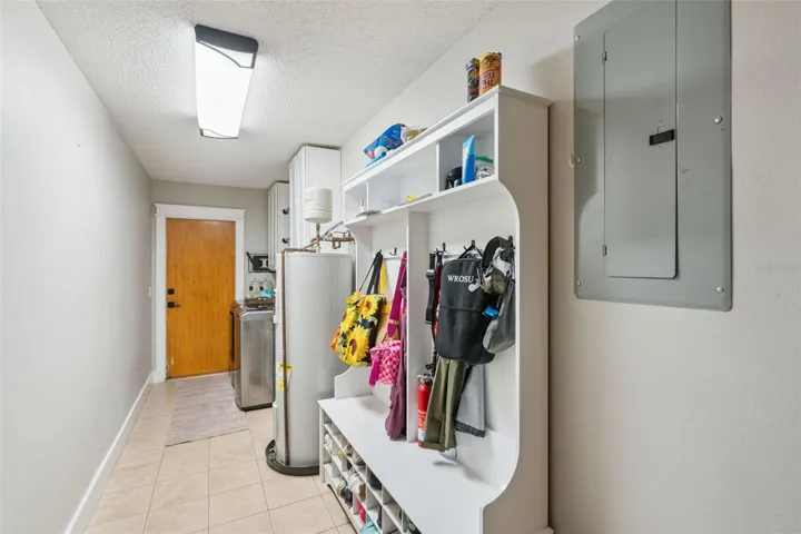 Interior laundry and utility area with storage and convenient access.
