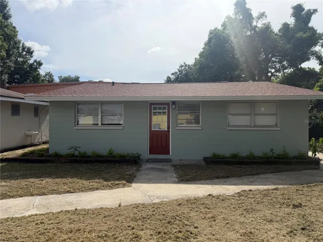 Charming 3-bedroom residence featuring a welcoming front entrance and private living space.