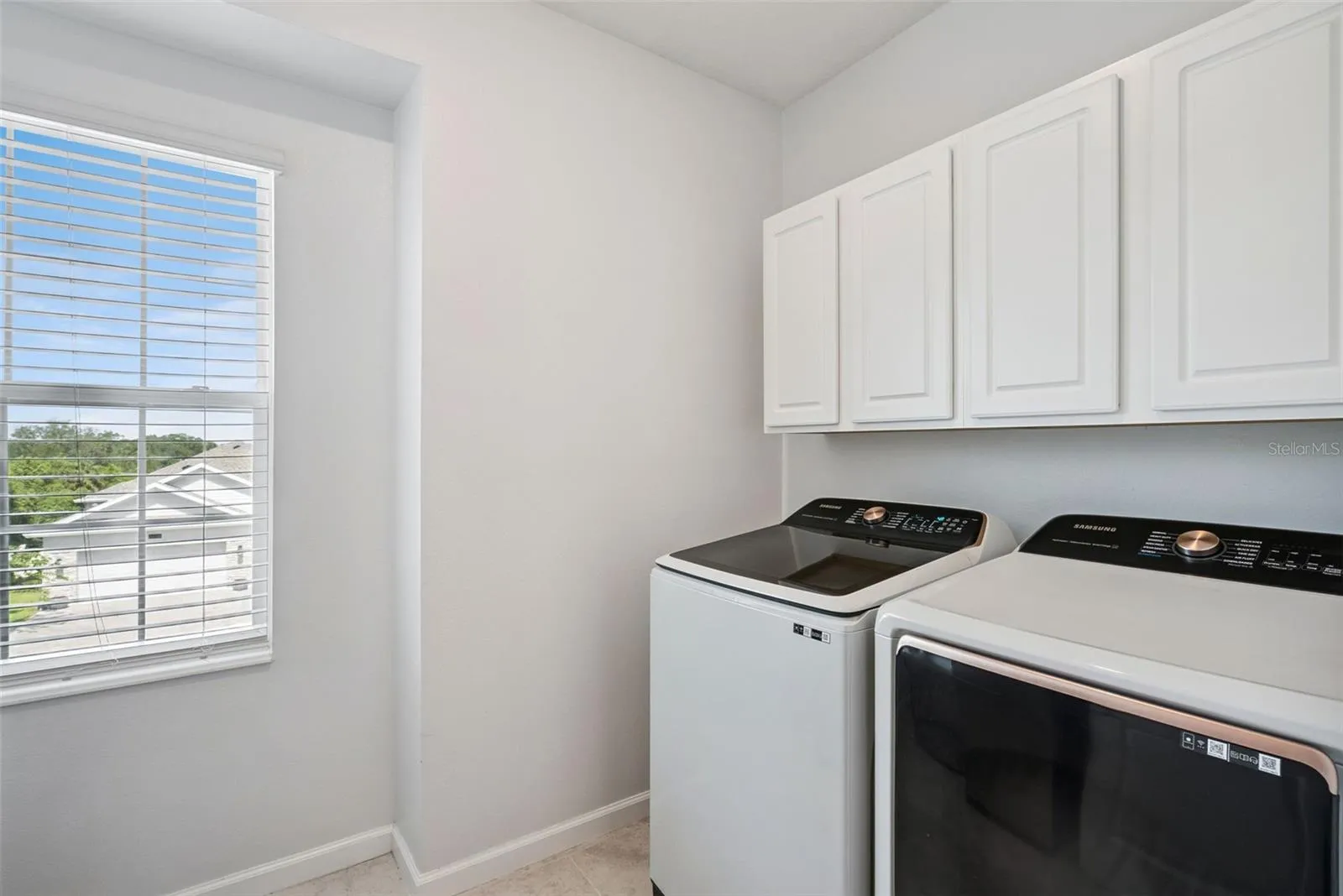 Upstairs laundry room with washer and dryer included