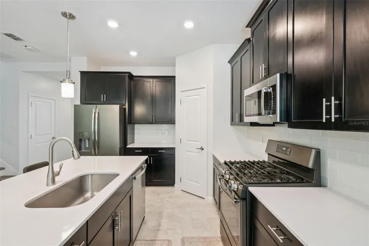 Stainless steel appliances and generous cabinet storage