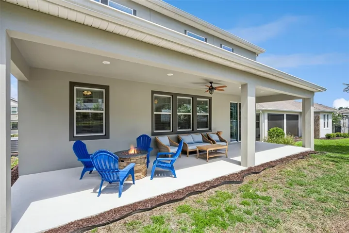 Covered rear porch for relaxing and entertaining